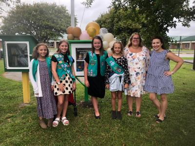 Girl Scouts in front of Blessing Box